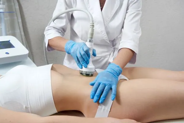 Lost the Weight but Not the Loose Skin? 2 woman having HIFU treatment on her stomach to combat loose skin Purfleet following weight loss